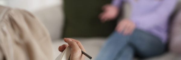 sided-view-young-girl-talking-therapist